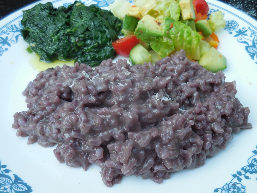 blueberry risotto plated with sides